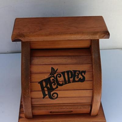 Wooden recipes box with vase of wooden utensils and a Pleasures from the good Earth cookbook