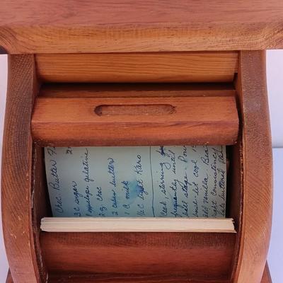 Wooden recipes box with vase of wooden utensils and a Pleasures from the good Earth cookbook