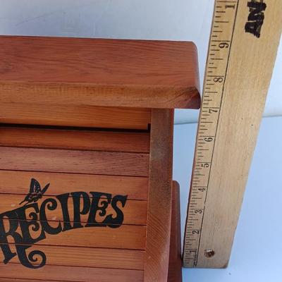 Wooden recipes box with vase of wooden utensils and a Pleasures from the good Earth cookbook
