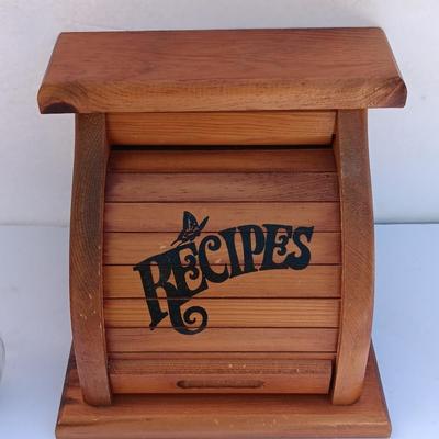 Wooden recipes box with vase of wooden utensils and a Pleasures from the good Earth cookbook