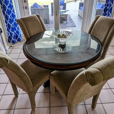 Round dining room table with glass top and 4 Upholstered chairs