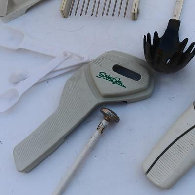 Assortment of mostly white handed Kitchen utensils -