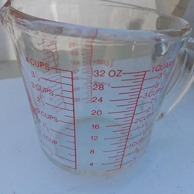 Large stainless bowl - Fire King measuring glass - and a cake pan