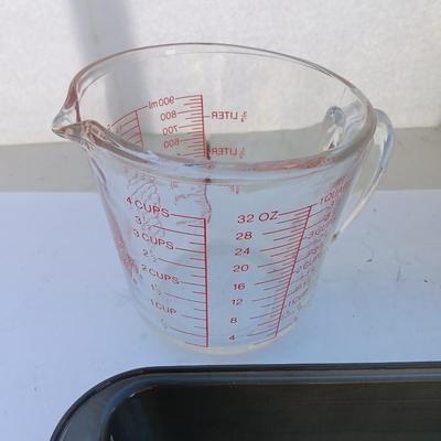 Large stainless bowl - Fire King measuring glass - and a cake pan