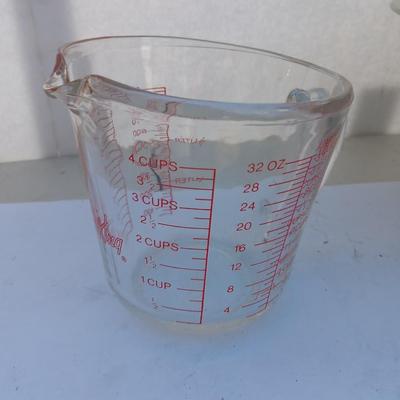 Large stainless bowl - Fire King measuring glass - and a cake pan