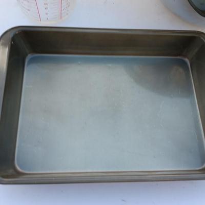Large stainless bowl - Fire King measuring glass - and a cake pan