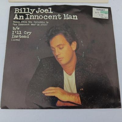 Two 45 LP Records - Billy Joel and Foreigner with original sleeves