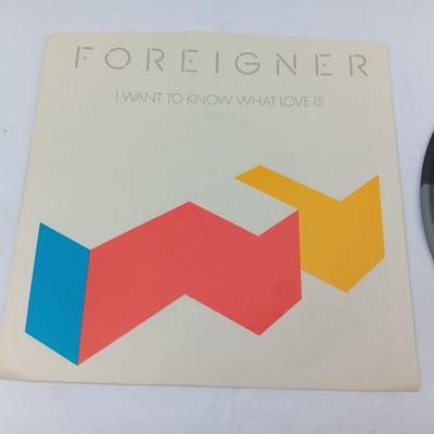 Two 45 LP Records - Billy Joel and Foreigner with original sleeves