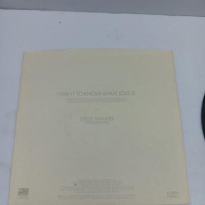 Two 45 LP Records - Billy Joel and Foreigner with original sleeves