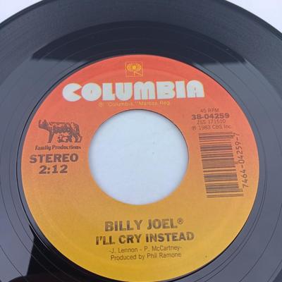 Two 45 LP Records - Billy Joel and Foreigner with original sleeves