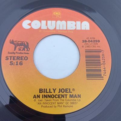 Two 45 LP Records - Billy Joel and Foreigner with original sleeves