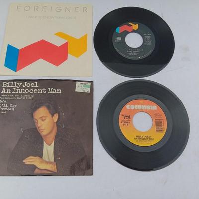 Two 45 LP Records - Billy Joel and Foreigner with original sleeves
