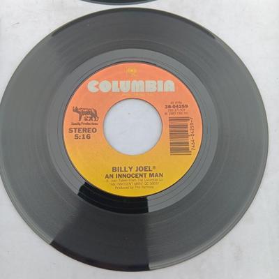Two 45 LP Records - Billy Joel and Foreigner with original sleeves