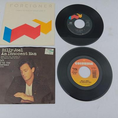 Two 45 LP Records - Billy Joel and Foreigner with original sleeves