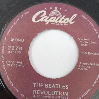 Four 45 LP Records -The rolling stones - The Doobie Brothers - The Beatles - and Elton John