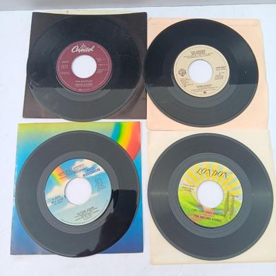 Four 45 LP Records -The rolling stones - The Doobie Brothers - The Beatles - and Elton John