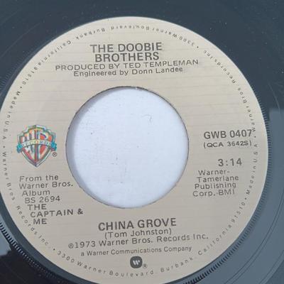 Four 45 LP Records -The rolling stones - The Doobie Brothers - The Beatles - and Elton John
