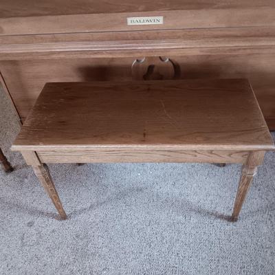 BALDWIN ACROSONIC PIANO ON CASTERS W/BENCH AND SHEET MUSIC