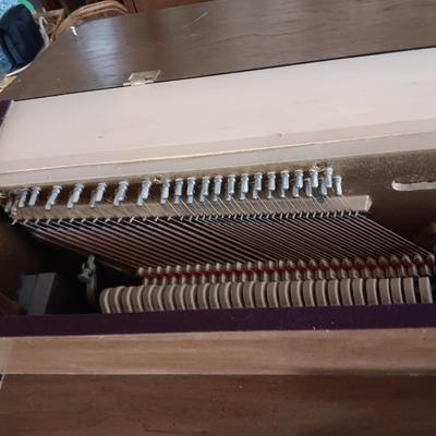 BALDWIN ACROSONIC PIANO ON CASTERS W/BENCH AND SHEET MUSIC