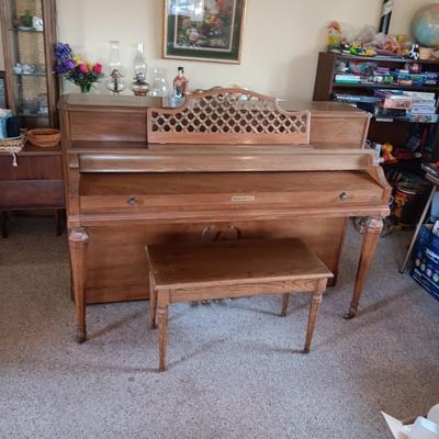 BALDWIN ACROSONIC PIANO ON CASTERS W/BENCH AND SHEET MUSIC