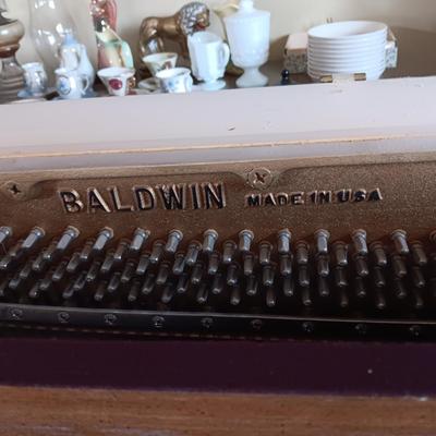 BALDWIN ACROSONIC PIANO ON CASTERS W/BENCH AND SHEET MUSIC