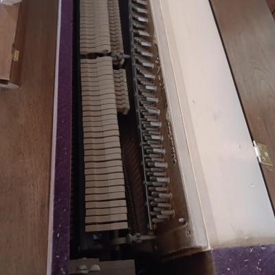 BALDWIN ACROSONIC PIANO ON CASTERS W/BENCH AND SHEET MUSIC