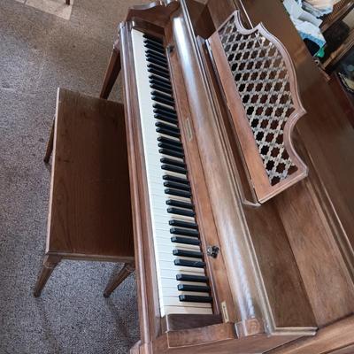 BALDWIN ACROSONIC PIANO ON CASTERS W/BENCH AND SHEET MUSIC