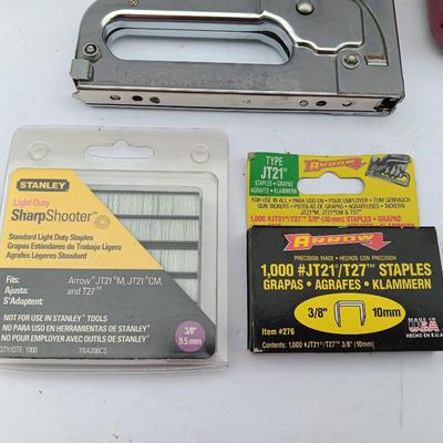 Variety of hand Tools - Stapler with staples - pliers - and 25-foot tape measure