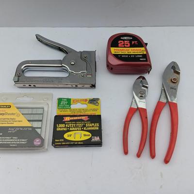 Variety of hand Tools - Stapler with staples - pliers - and 25-foot tape measure