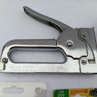 Variety of hand Tools - Stapler with staples - pliers - and 25-foot tape measure