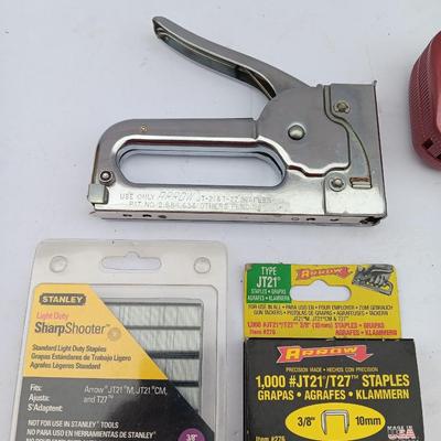 Variety of hand Tools - Stapler with staples - pliers - and 25-foot tape measure