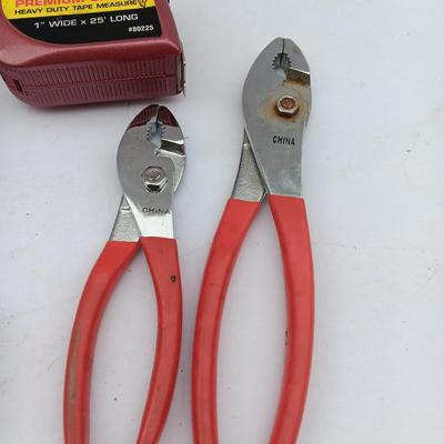 Variety of hand Tools - Stapler with staples - pliers - and 25-foot tape measure