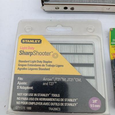 Variety of hand Tools - Stapler with staples - pliers - and 25-foot tape measure