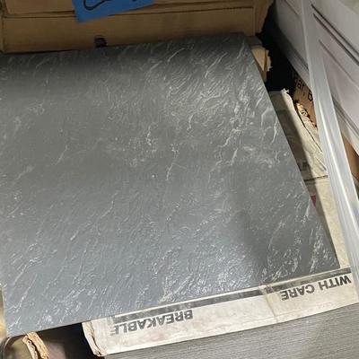 Lot of about 8 boxes of Gray Square ceramic Flooring Tiles