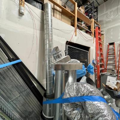 Pallet of various sized HVAC metal ductwork pieces