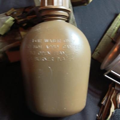 Military canteen with Military issued bags / pouches and a Citizen Quartz watch with a camo band