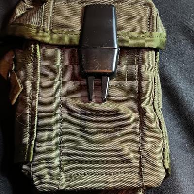 Military canteen with Military issued bags / pouches and a Citizen Quartz watch with a camo band