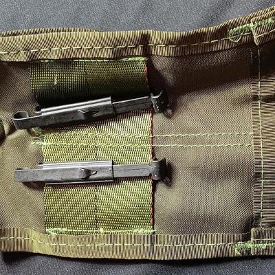 Military canteen with Military issued bags / pouches and a Citizen Quartz watch with a camo band