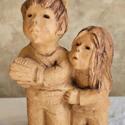2 figurines, child praying, children playing Ann Entis, Lee Bortin