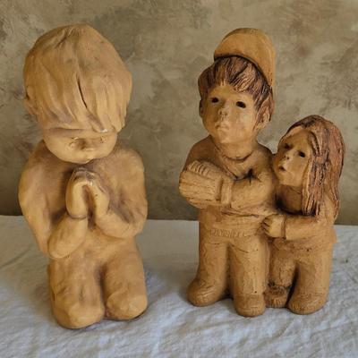 2 figurines, child praying, children playing Ann Entis, Lee Bortin