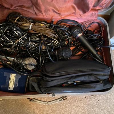 Cords and microphones in vintage suitcase