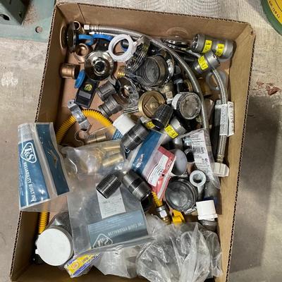 Box of misc. plumbing fixtures - hoses, covers, connectors