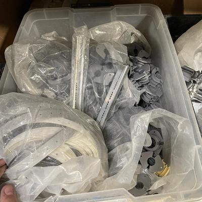 Plastic tub full of plastic plumbing fixtures/pipe sizers