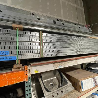 3 pcs. galvanized steel siding about 16' l pieces & stack of 2" x 4" and 2" x 6" galvanized steel studs...