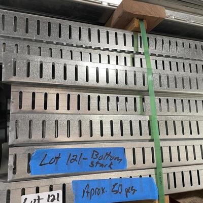 3 pcs. galvanized steel siding about 16' l pieces & stack of 2" x 4" and 2" x 6" galvanized steel studs...