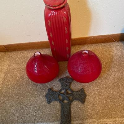 Red decor with large metal cross