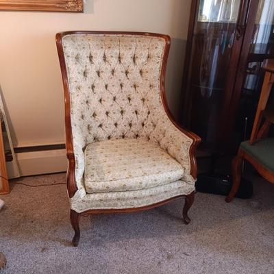 TUFTED WING BACK CHAIR AND A CARVED GLASS TOP SIDE TABLE