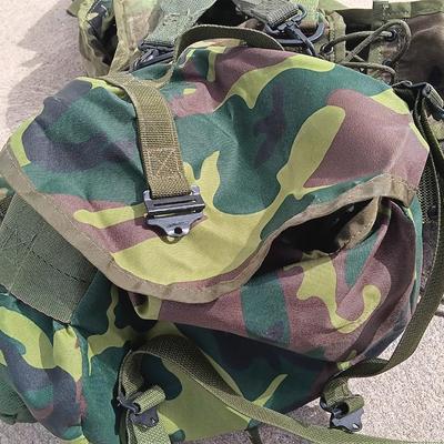 Military issued tactical load bearing vest with accessories.