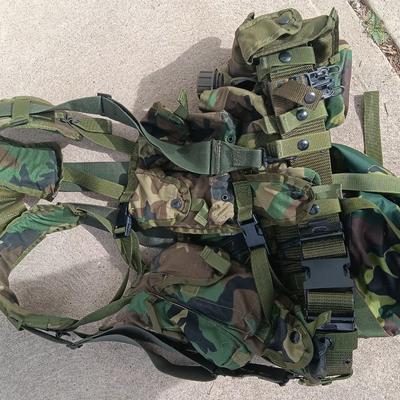 Military issued tactical load bearing vest with accessories.