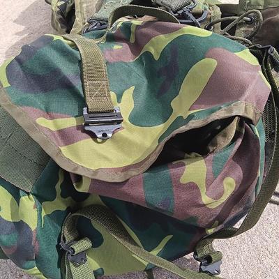 Military issued tactical load bearing vest with accessories.